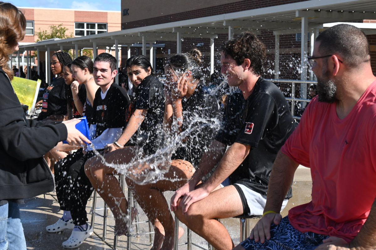 Senior Class Council members Dynasty Sutton (Left), Karina Verma, Isabella Laroche, Austin Hertz, Selena Awaad, Christine Doria, and Gage Cagle (Right) along with Seminole Teacher Adam Carpenter getting soaked to support the Senior Class.